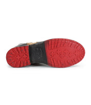 The image shows the bottom view of the Bed Stu Ethic Chelsea boot, highlighting its red Vibram sole with patterned treads and a black leather upper visible along the edge.