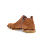 A single Evade brown suede ankle boot by Bed Stu, handcrafted in Italy, featuring a side zipper and a textured rubber sole.