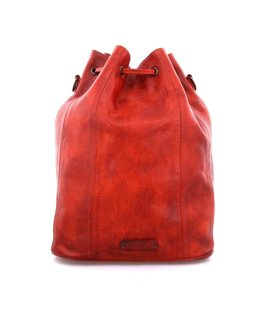An Eve by Bed Stu red leather bucket bag on a white background.