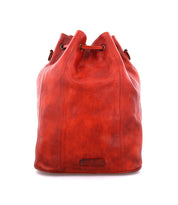 An Eve by Bed Stu red leather bucket bag on a white background.