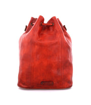 An Eve by Bed Stu red leather bucket bag on a white background.