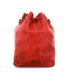 An Eve by Bed Stu red leather bucket bag on a white background.