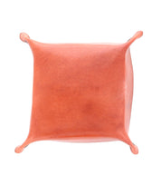 A square, orange leather pouch viewed from above, with rounded corners and extended tips on each side, perfect as a stylish Bed Stu Expanse Catchall Tray for your loose change and keys.