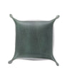 A square green leather Expanse pillow on a white background by Bed Stu.