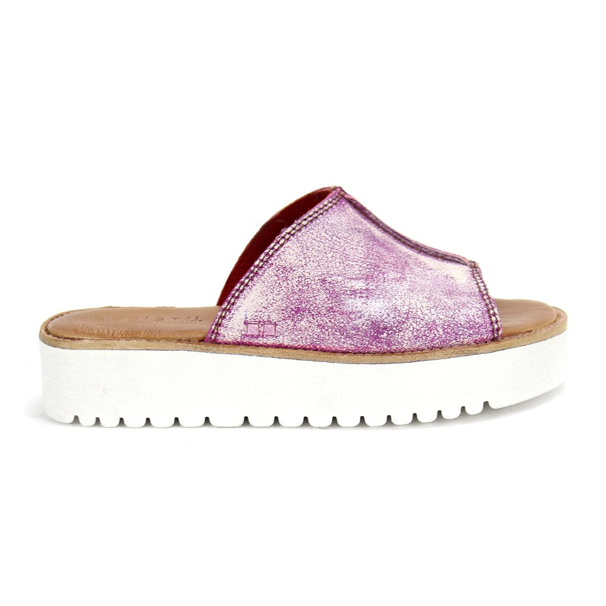 The Fairlee II slide sandal by Bed Stu features a glittery pink upper and a thick white platform sole with plush cushioning, showcased on a white background.
