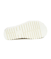 The image displays the sole of the Fairlee II, an eco-friendly sandal by Bed Stu, featuring a ribbed pattern on a white surface.
