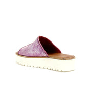 The Fairlee II by Bed Stu is a pink leather flatform slide sandal with a textured upper and thick white sole, designed for plush cushioning. Displayed on a white background, it combines style and comfort perfectly.