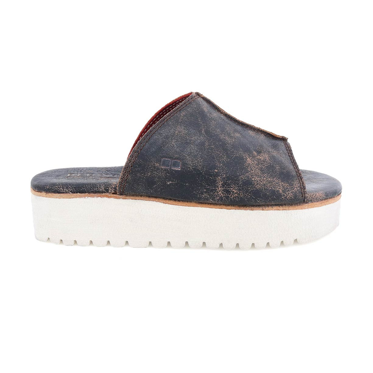 A women's Fairlee II leather slide sandal with a white sole by Bed Stu.