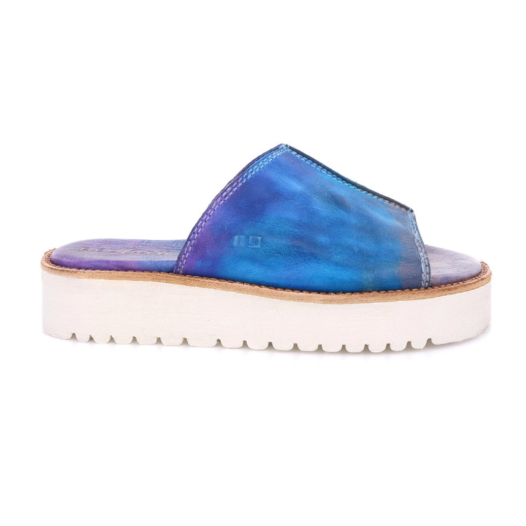 A women's Fairlee II slide on sandal in blue and white by Bed Stu.