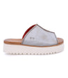 A women's Fairlee II slipper with a red sole by Bed Stu.