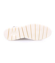 A Fairman shoe with white soles on a white background by Bed Stu.
