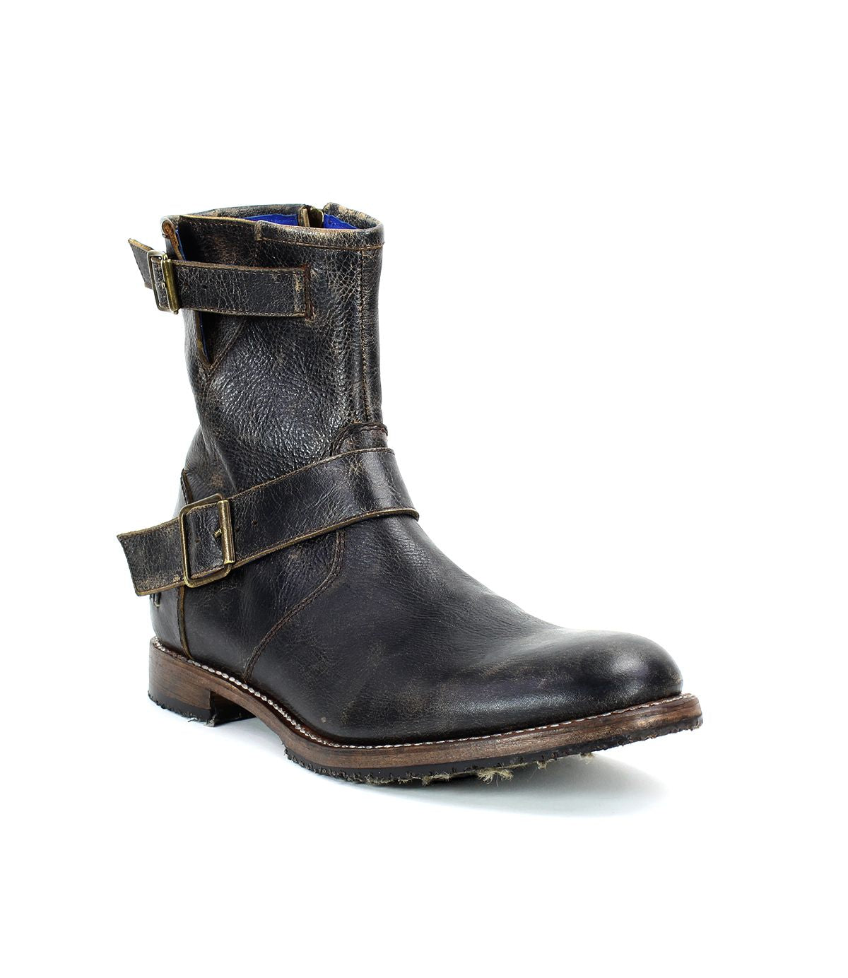 The Bed Stu "Fellow" boot features brown leather with two buckled straps and a low heel, offering a moto-inspired edge, shown from the side against a white background.