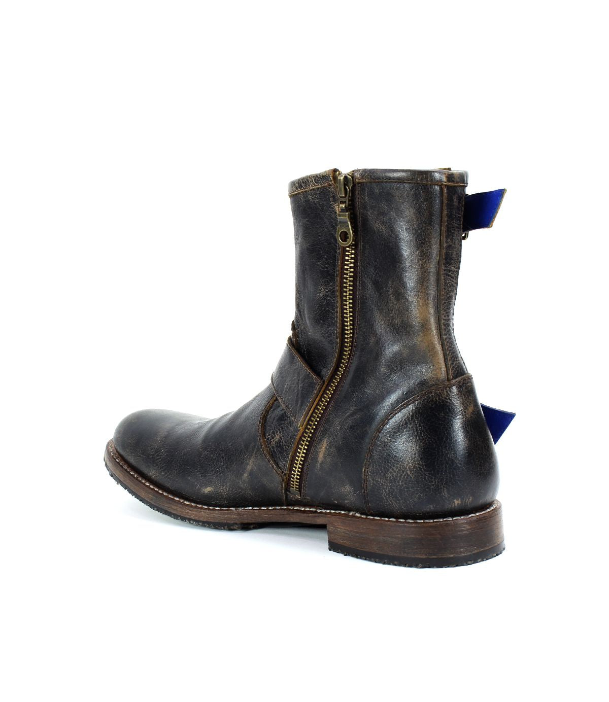 The Fellow boot by Bed Stu, made of brown leather with a moto-inspired design, includes a side zipper and a blue pull tab at the back, showcased from a side view.