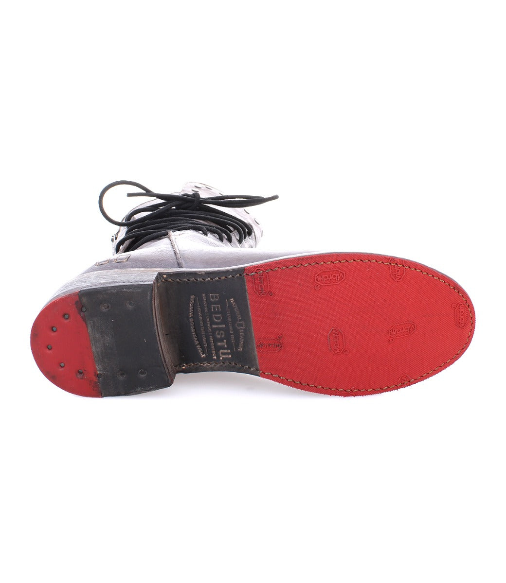 A pair of Fen shoes with red soles and a white sole from Bed Stu.