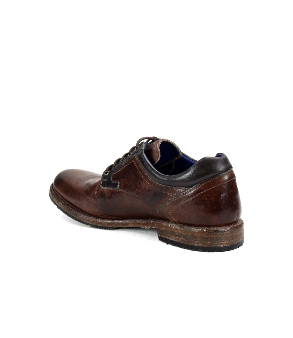 The Fierce derby shoe by Bed Stu, featuring a classic design in brown leather, displays scuffing on the sole and heel and is shown from the rear angle against a white background.