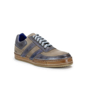The Bed Stu Firepower is a gray and blue men's casual sneaker with a gum sole. It features a leather stripe, lace-up closure, classic vulcanized style, and two side stripes.