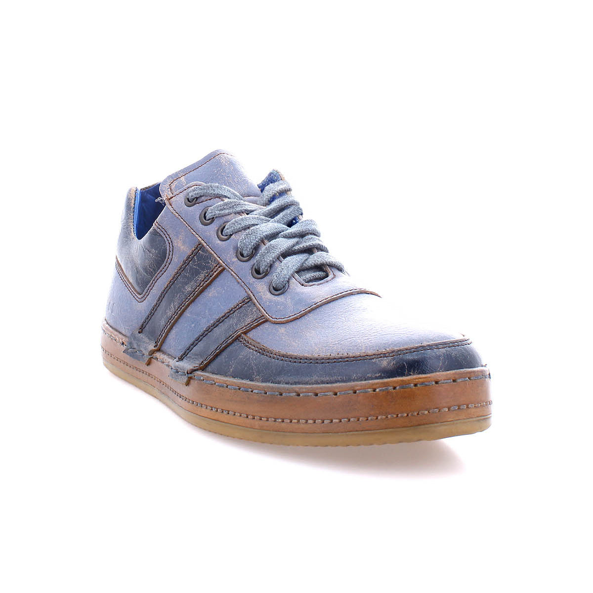 The Bed Stu Firepower is a blue men's sneaker with brown accents, leather stripe details, and a vulcanized rubber sole, shown on a white background.
