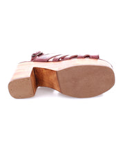 A pair of Fontella shoes with a wooden sole and a wooden heel by Bed Stu.