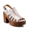 A women's white platform sandal with a wooden platform, called Fontella by Bed Stu.