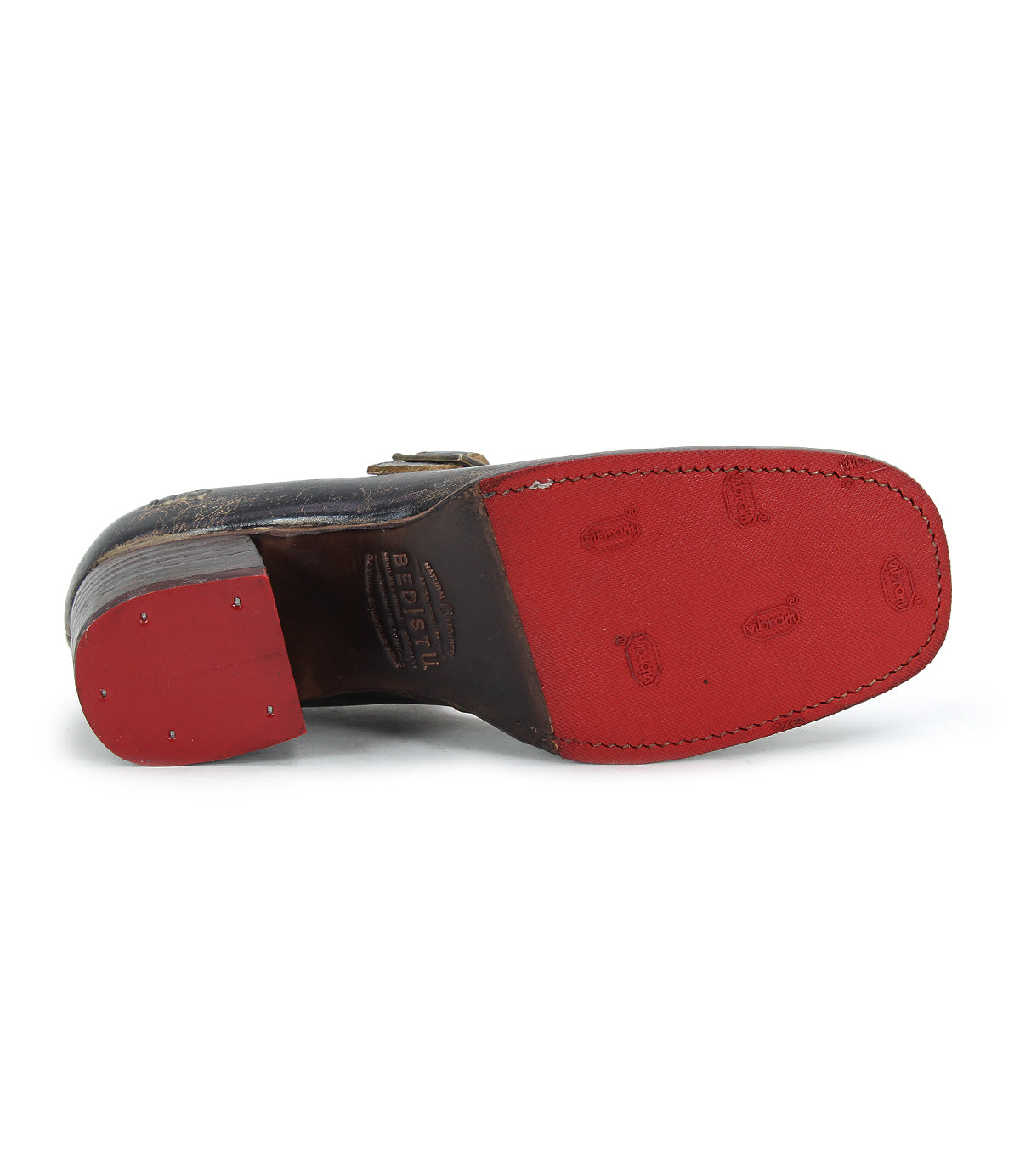 A single Forefront by Bed Stu with a red sole, small metal studs on the heel, and an adjustable strap, shown from the bottom.
