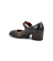 Side view of a weathered, black leather Forefront by Bed Stu featuring a comfortable, chunky heel and an adjustable buckle strap.