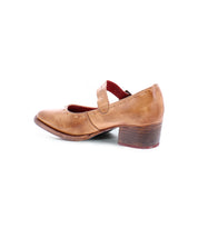 A brown, worn-out leather Forefront from Bed Stu with a comfortable heel and an adjustable strap across the top, shown from the side.