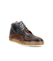 The Bed Stu Formation sneaker is a brown and black high-top with gray laces and a textured vulcanized-style sole, shown from the front at an angle.