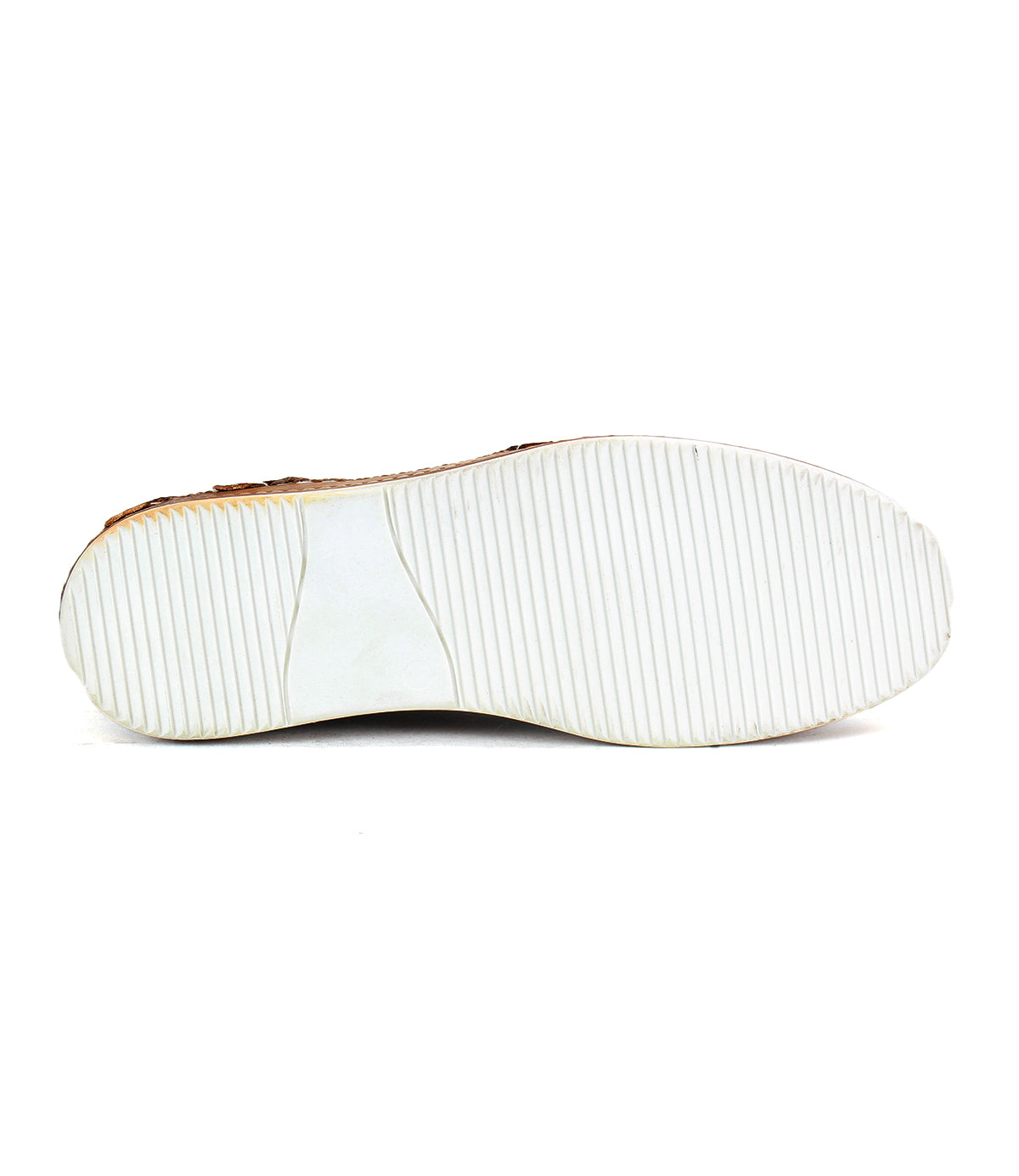 The sole of the Bed Stu Formation, a white sneaker, is viewed from the bottom, highlighting its vulcanized style with a distinctive ridged pattern.