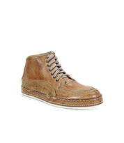 The Bed Stu "Formation" high-top sneaker is crafted in brown leather with a vulcanized design, detailed stitching, white soles, beige laces, and a raised heel, viewed from the side.