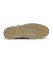 Bottom view of the Bed Stu Freestyle, a beige rubber-sole sneaker showcasing a textured tread and horizontal ridge pattern. The design exudes casual sophistication with its refined detailing.