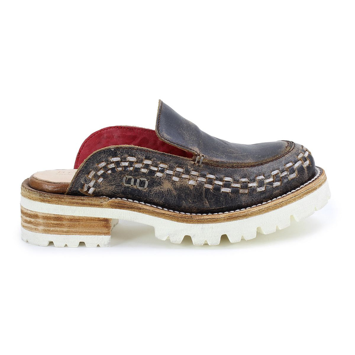 The Bed Stu Fuel is a single brown leather mule shoe featuring handwoven details, white stitching, a red lining, chunky lightweight white sole, and stacked wooden heel, shown from the side.