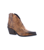 The Furio boot by Bed Stu, a single Western-inspired piece handcrafted in Italy and featuring brown leather with a pointed toe and mid-height heel, is displayed on a white background.