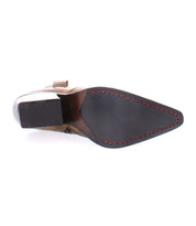 A sole view of the Furio dress shoe by Bed Stu, handcrafted in Italy and featuring a black rubber bottom with red stitching around the edges.