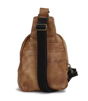 A Beau brown leather sling bag with black straps by Bed Stu.