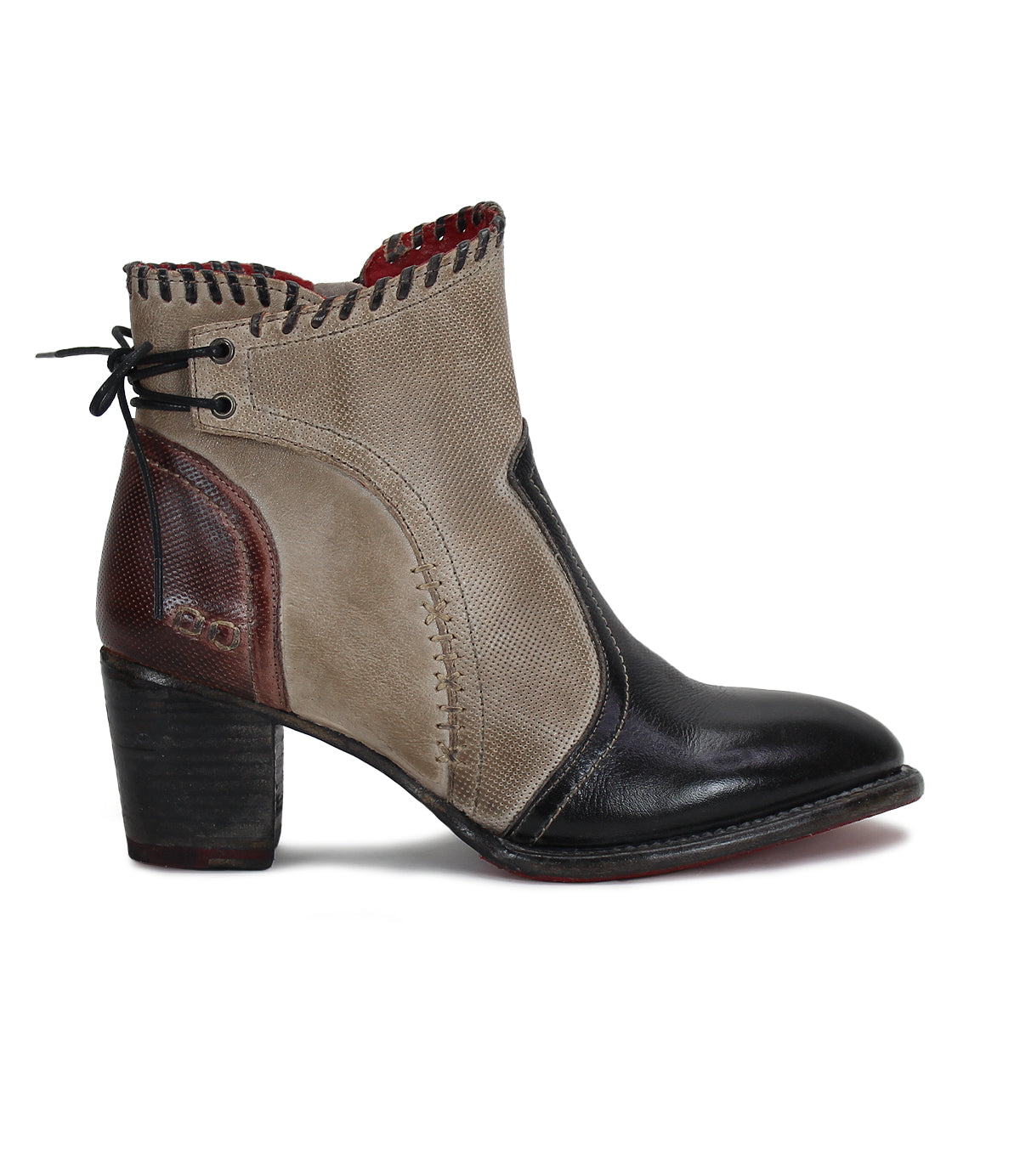 A women's Bia ankle boot in beige and black by Bed Stu.