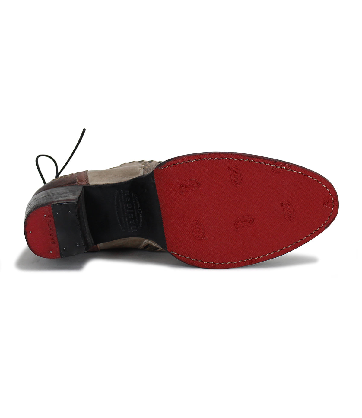 A pair of Bia shoes with red soles on a white background, by Bed Stu.