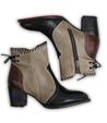 A pair of Bia ankle boots by Bed Stu with tan and black accents.