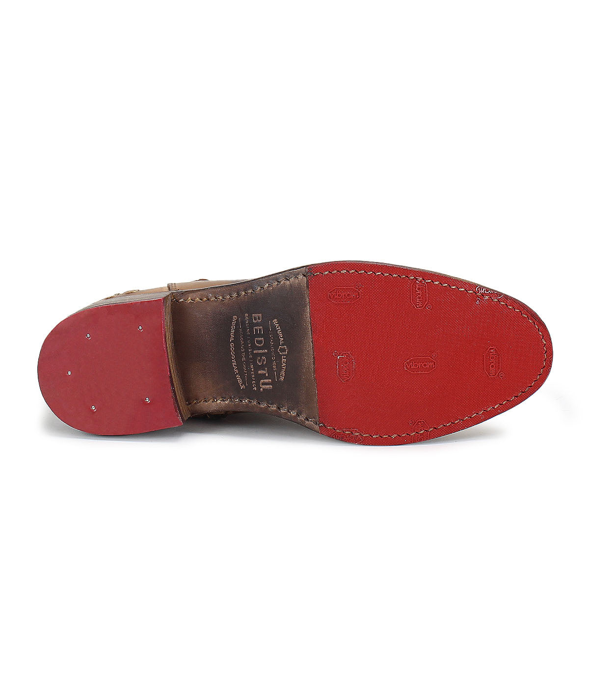 A pair of Bed Stu Alina shoes with red soles on a white background.