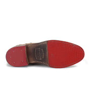 A pair of Bed Stu Alina shoes with red soles on a white background.