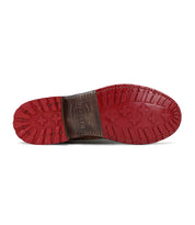A pair of Jacqueline shoes with red soles on a white background by Bed Stu.