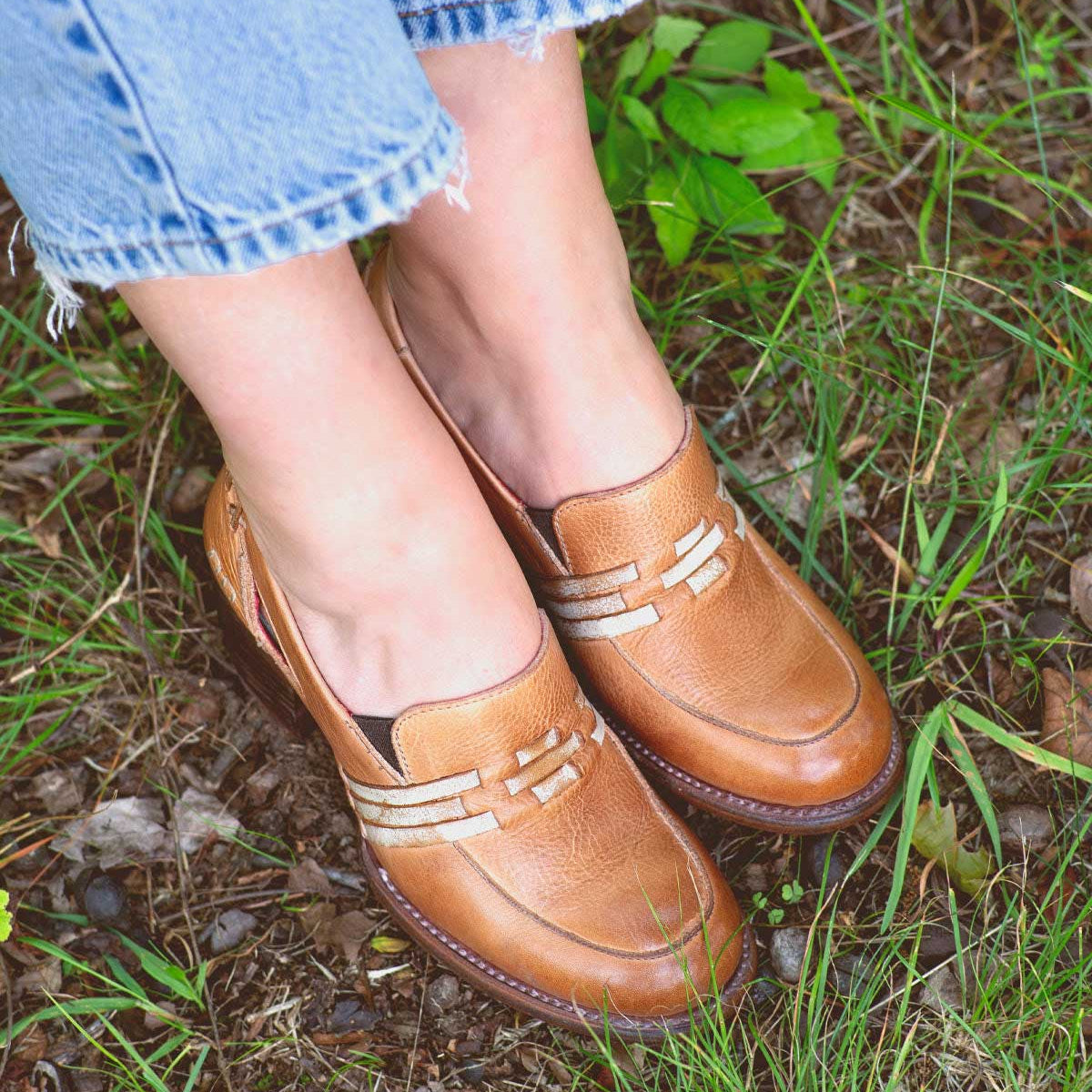 A woman's feet in a pair of Bed Stu Gabrianna loafers.