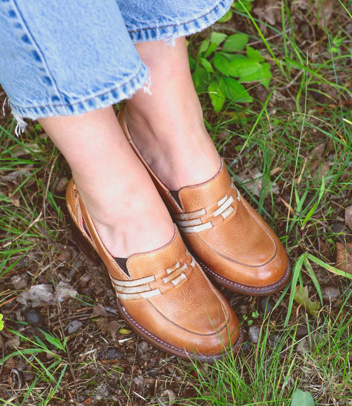 A woman's feet in a pair of Bed Stu Gabrianna loafers.