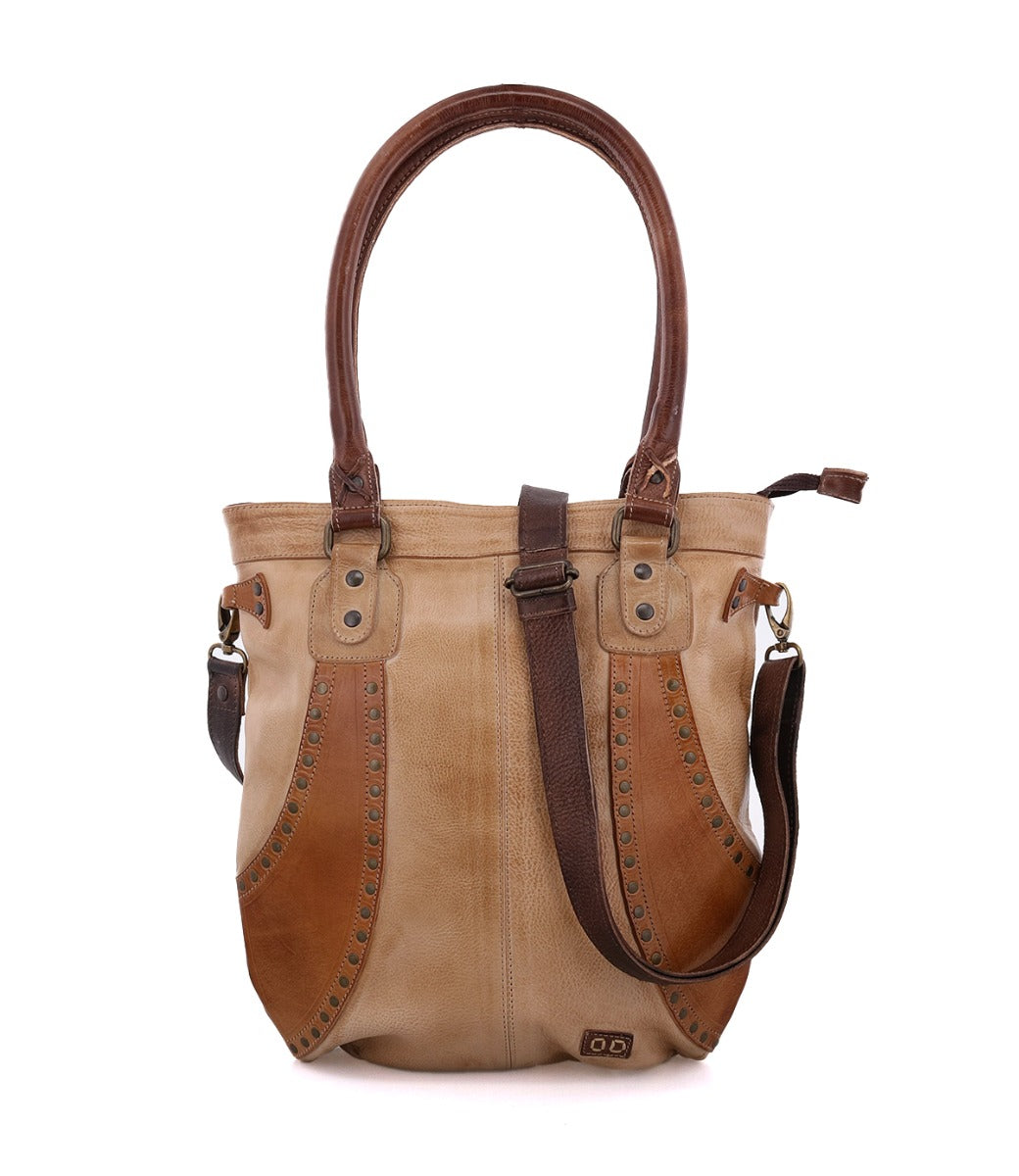 A brown and tan Bed Stu Gala handbag with straps.