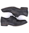 A pair of Bed Stu Galao men's black shoes on a white background.