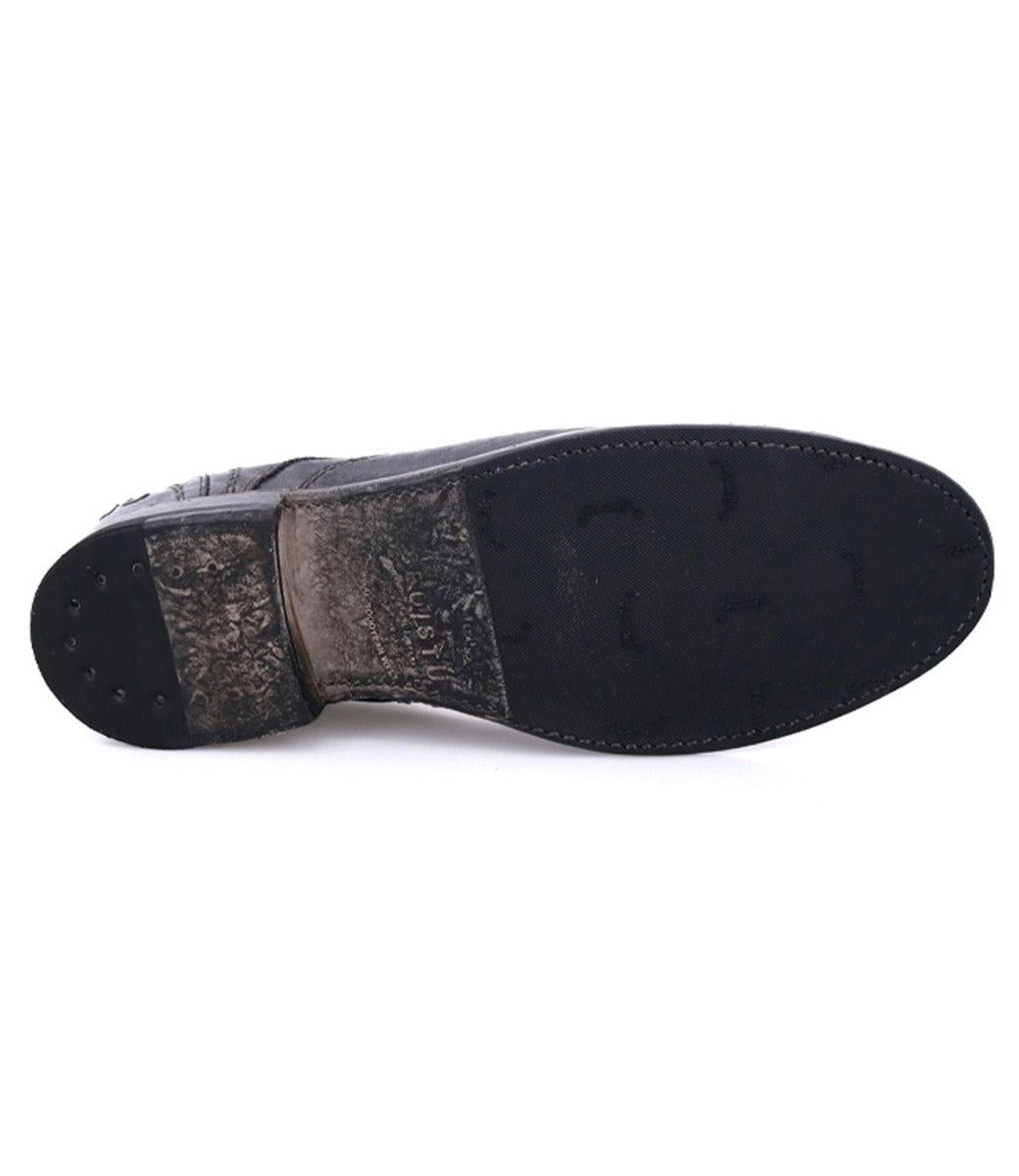 A pair of Bed Stu Galao shoes with a black sole on a white background.