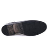 A pair of Bed Stu Galao shoes with a black sole on a white background.