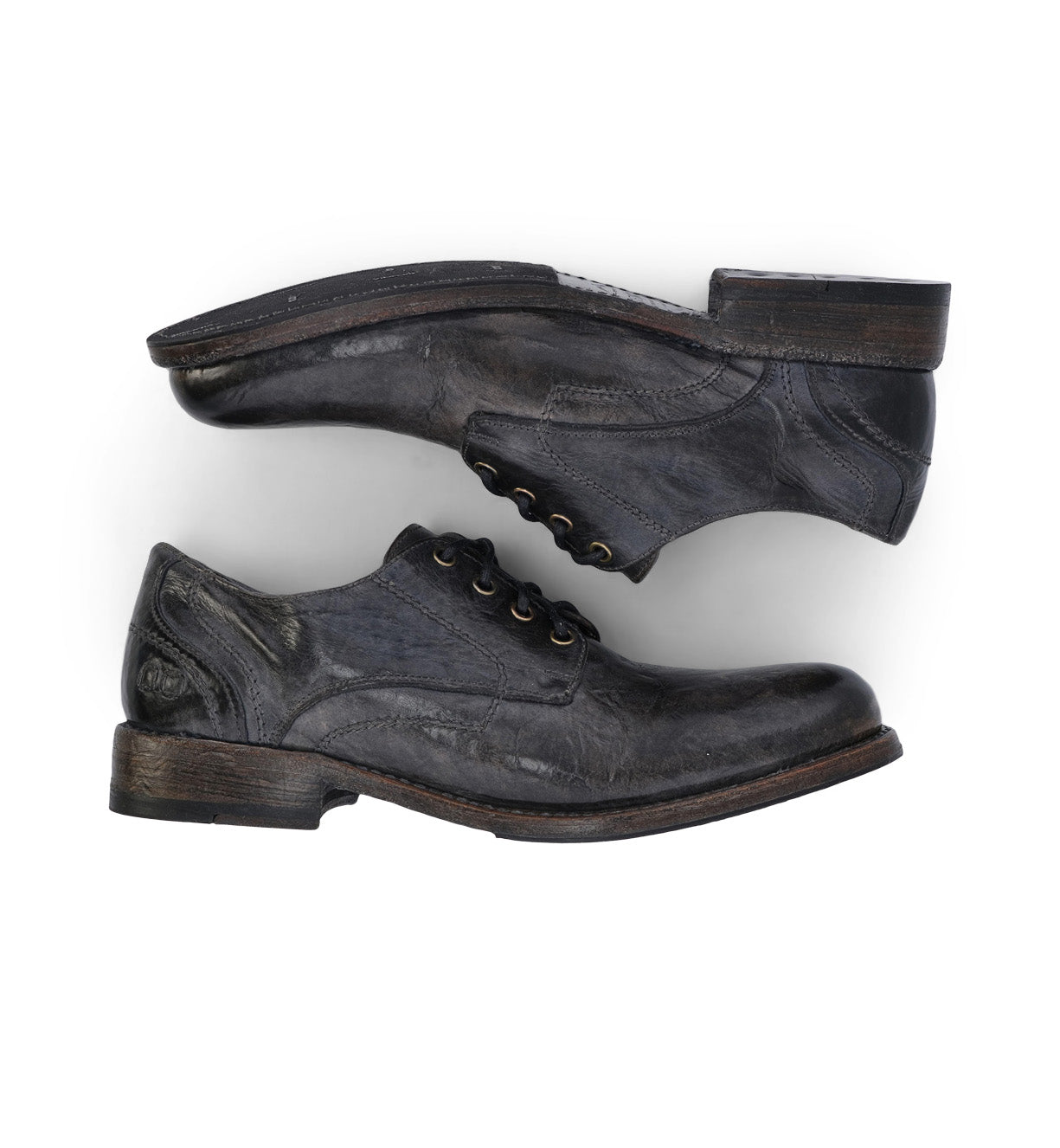 A pair of Bed Stu Galao men's grey leather shoes on a white background.