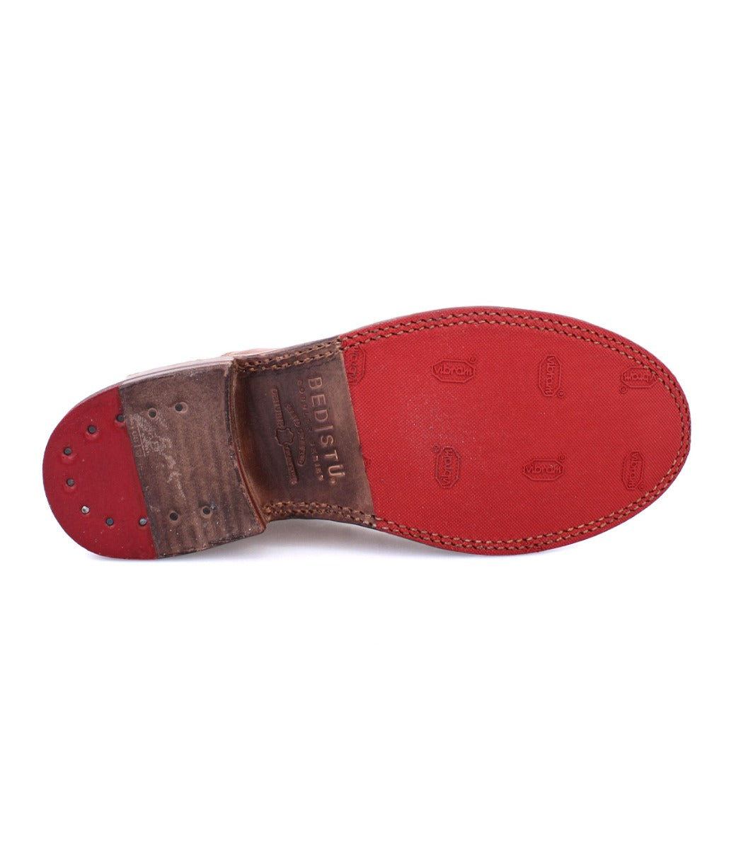 A pair of Garden M shoes with red soles and a red sole by Bed Stu.