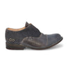 A pair of Bed Stu men's blue Garden M shoes with a leather sole.