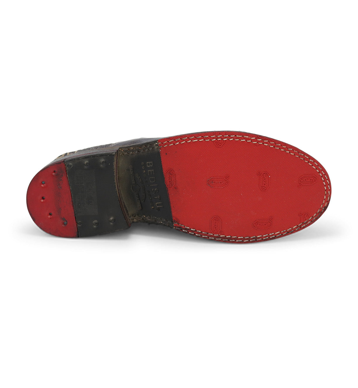 A pair of Garden M shoes by Bed Stu with red soles on a white background.